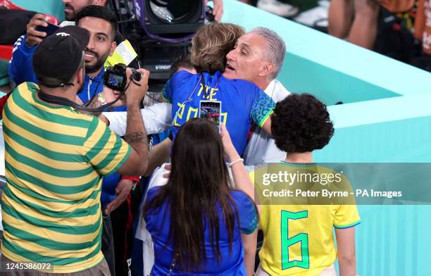 Brazil manager Tite hugs wife Rosmari Rizzi Bachi before the FIFA World Cup Round of Sixteen match at Stadium 974 in Doha, Qatar. Picture date:...