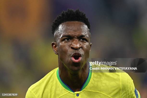 Brazil's forward Vinicius Junior celebrates scoring his team's first goal during the Qatar 2022 World Cup round of 16 football match between Brazil...