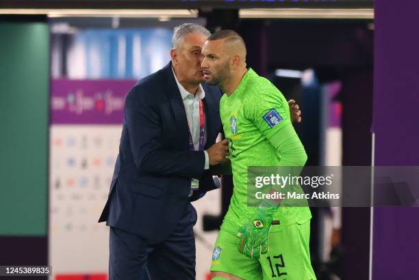 Brazil's Weverton is spoken to by Brazil Manager Tite ahead of him coming on a substitute during the FIFA World Cup Qatar 2022 Round of 16 match...