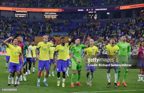 Marquinhos, Pedro, Vinicius Junior, Ederson, Richarlison, Lucas Paqueta and Weverton of Brazil celebrate after the FIFA World Cup Qatar 2022 Round of...