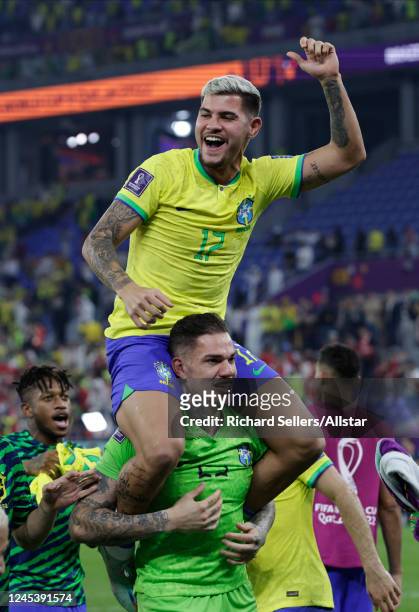 Bruno Guimaraes and Ederson, Goalkeeper of Brazil celebrating after the FIFA World Cup Qatar 2022 Round of 16 match between Brazil and South Korea at...