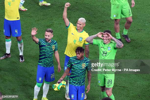 Brazil's Richarlison, Everton Ribeiro, Fred and goalkeeper Ederson applaud the crowd after the final whistle following victory in the FIFA World Cup...