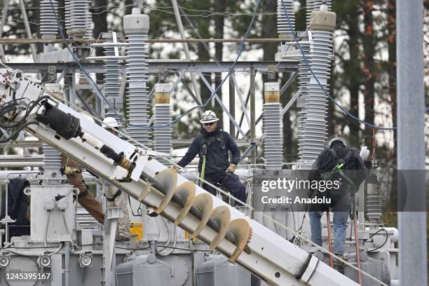 View of the substation while work is in progress as tens of thousands are without power on Moore County after an attack at two substations by Duke...