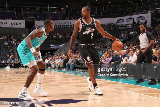 Kawhi Leonard of the LA Clippers handles the ball during the game against the Charlotte Hornets on December 5, 2022 at Spectrum Center in Charlotte,...