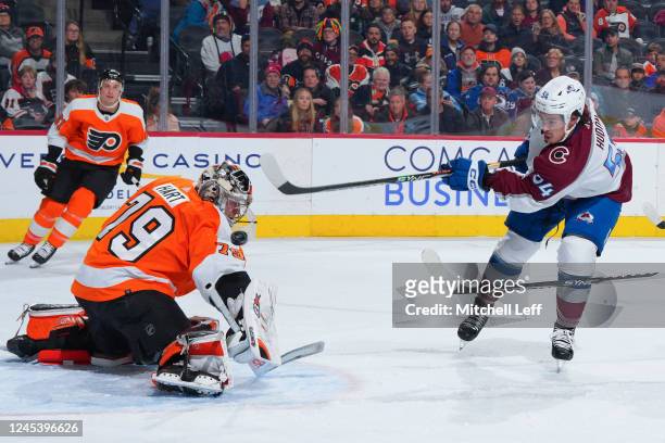 Carter Hart of the Philadelphia Flyers makes a save against Charles Hudon of the Colorado Avalanche in the first period at the Wells Fargo Center on...