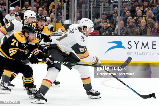 Boston Bruins left wing Taylor Hall back checks on Vegas Golden Knights right wing Mark Stone during a game between the Boston Bruins and the Vegas...
