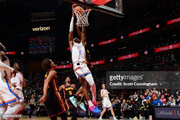 Shai Gilgeous-Alexander of the Oklahoma City Thunder drives to the basket during the game against the Atlanta Hawks on December 5, 2022 at State Farm...
