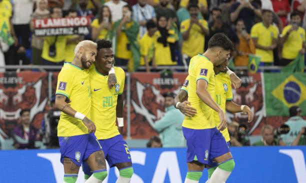 Players of Brazil celebrate after scoring goal during the FIFA World Cup Qatar 2022 Round of 16 match between Brazil and South Korea at Stadium 974...