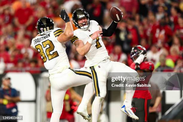 Taysom Hill of the New Orleans Saints celebrates with Adam Trautman after scoring a touchdown during the second quarter of an NFL football game...