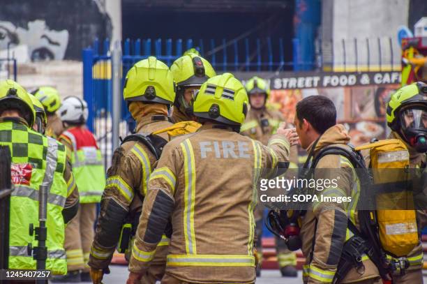 London Fire Brigade firefighters on the scene of a blaze which broke out near London Bridge Station.