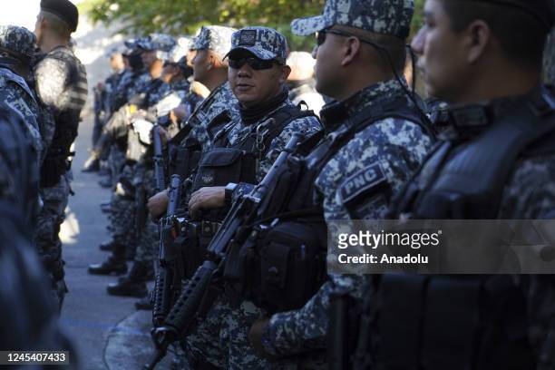 Police officers lineup before performing an an operative performed in the city of Soyapango in San Salvador, El Salvador, on December 5, 2022. The...