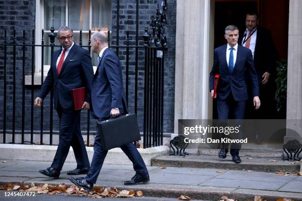 James Cleverly MP Secretary of State for Foreign Commonwealth and Development Affairs talks to Sir Philip Barton, permanent sec of the FCDO next to...