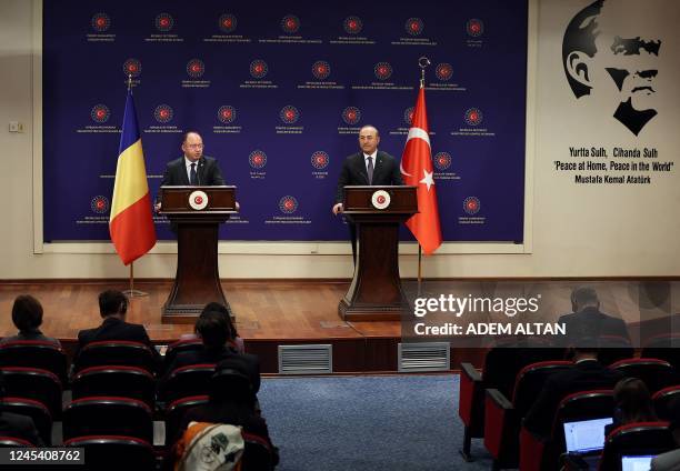 Turkish Foreign Minister Mevlut Cavusoglu and Romanian counterpart Bogdan Aurescu addresses media during a press conference in Ankara, on December 6,...