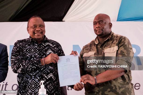 Former Kenyan President Uhuru Kenyatta and Serge Tshibangu Nzenza, special envoy and advisor to the President of the Democratic Republic of Congo ,...