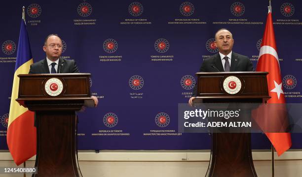 Turkish Foreign Minister Mevlut Cavusoglu and Romanian counterpart Bogdan Aurescu addresses media during a press conference in Ankara, on December 6,...