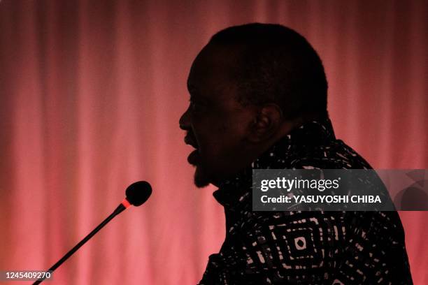 Former Kenyas President Uhuru Kenyatta speaks on the stage during the East African Community - led Nairobi Process, the third peace talk on the...