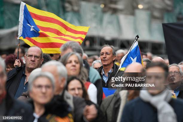 Protesters wave Catalan pro-independence "Estelada" flags during a rally against changes to sedition law, called by the Catalan National Assembly and...