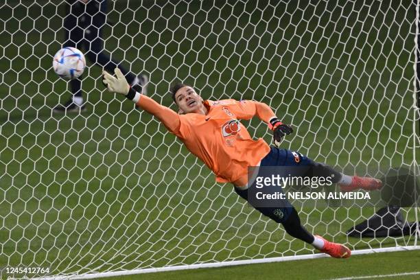 Brazil's goalkeeper Ederson takes part in a training session at the Al Arabi SC Stadium in Doha on December 6 in the build-up to the Qatar 2022 World...