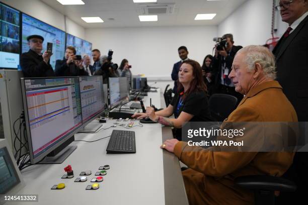 King Charles III is shown the control room during a visit to Luton DART Parkway Station to learn about the new cable-drawn mass passenger transit...