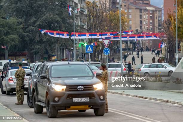 General view of the scene as security forces take measures nearby the Municipal Elections Commission office on the northern bank of the Ibar river of...