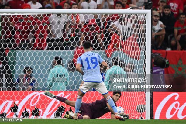 Spain's midfielder Carlos Soler fails to score during penalty shoot-out in the Qatar 2022 World Cup round of 16 football match between Morocco and...