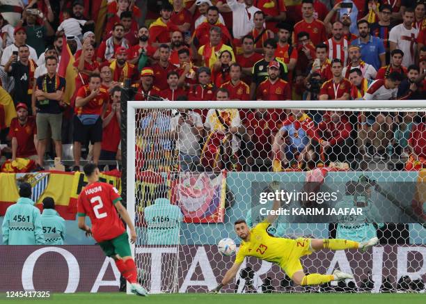 Morocco's defender Achraf Hakimi converts during the penalty shoot-out to win the Qatar 2022 World Cup round of 16 football match between Morocco and...