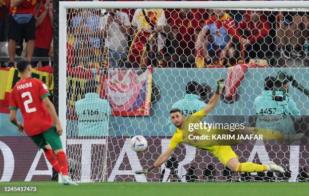 Morocco's defender Achraf Hakimi converts during the penalty shoot-out to win the Qatar 2022 World Cup round of 16 football match between Morocco and...