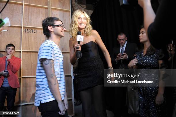 Heidi Klum interviews designer Christian Siriano backstage at the Christian Siriano Spring 2012 fashion show during Mercedes-Benz Fashion Week at...