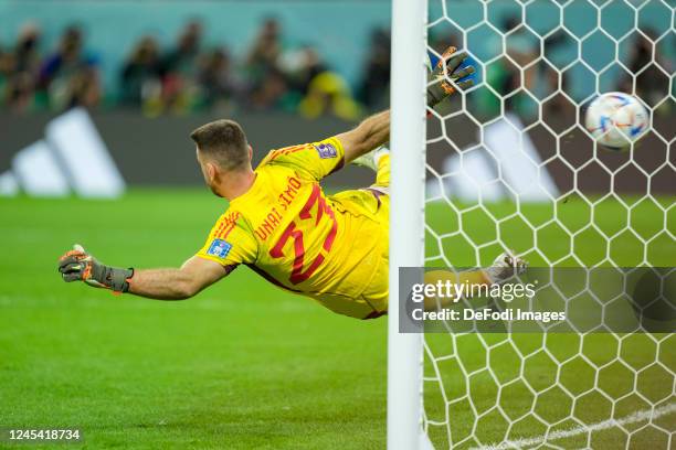 Hakim Ziyech of Morocco scores with the second penalty during the FIFA World Cup Qatar 2022 Round of 16 match between Morocco and Spain at Education...