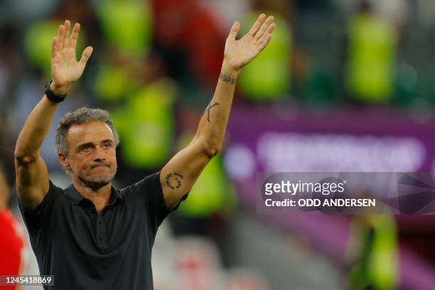 Spain's coach Luis Enrique waves to supporters after his team lost the Qatar 2022 World Cup round of 16 football match between Morocco and Spain at...