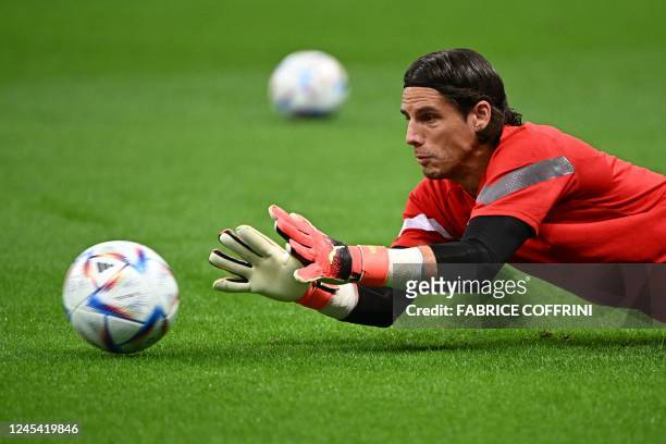 Switzerland's goalkeeper Yann Sommer warms up during the Qatar 2022 World Cup round of 16 football match between Portugal and Switzerland at Lusail...