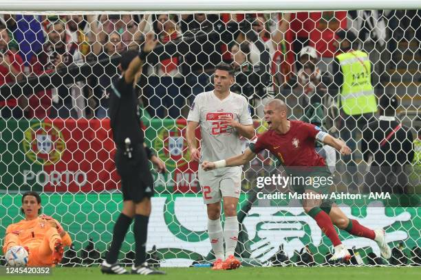 Pepe of Portugal celebrates after scoring a goal to make it 2-0 during the FIFA World Cup Qatar 2022 Round of 16 match between Portugal and...