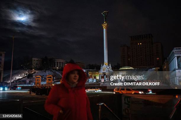 Woman walks at Kyiv's "Maidan" Independence Square on December 6, 2022.