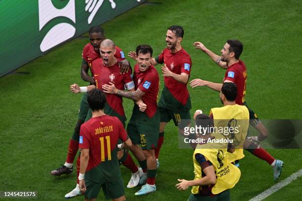 Pepe of Portugal celebrates after scoring a goal with his teammates during the FIFA World Cup Qatar 2022 Round of 16 match between Portugal and...