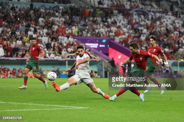Raphael Guerreiro of Portugal scores a goal to make it 4-0 during the FIFA World Cup Qatar 2022 Round of 16 match between Portugal and Switzerland at...