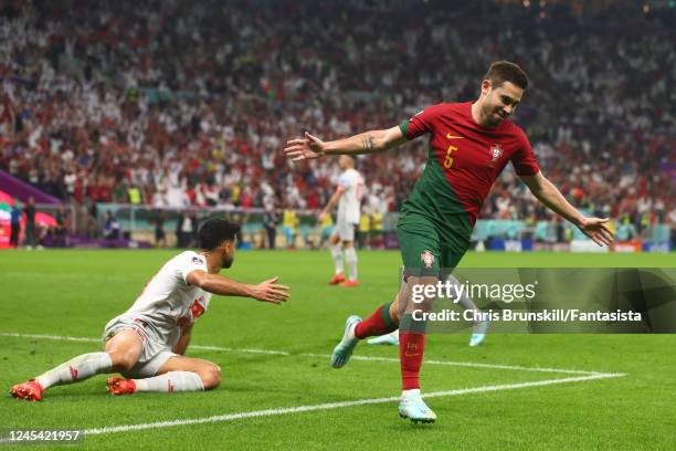 Raphael Guerreiro of Portugal celebrates scoring his sides fourth goal during the FIFA World Cup Qatar 2022 Round of 16 match between Portugal and...