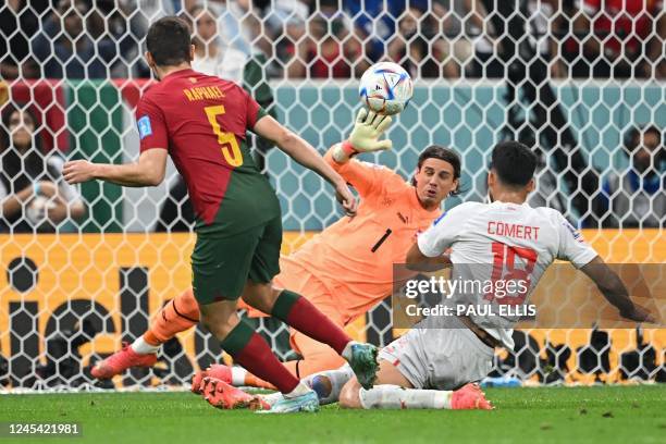 Portugal's defender Raphael Guerreiro scores his team's fourth goal during the Qatar 2022 World Cup round of 16 football match between Portugal and...