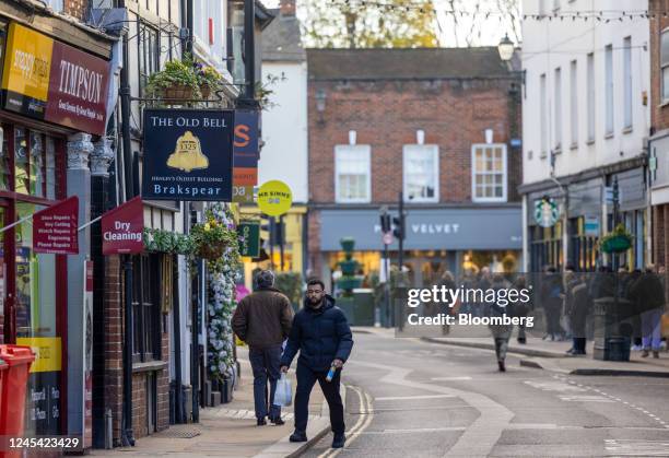 Shoppers on the high street in Henley-on-Thames, UK, on Tuesday, Dec. 6, 2022. HSBC Holdings Plc has announced plans to shutter more than 100 of its...