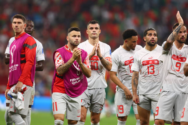 Granit Xhaka of Switzerland & team-mates react at the end of the FIFA World Cup Qatar 2022 Round of 16 match between Portugal and Switzerland at...