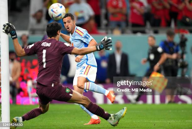 Pablo Sarabia of Spain competes for the ball with Yassine Bounou of Morocco ,during the FIFA World Cup Qatar 2022 Round of 16 match between Morocco...