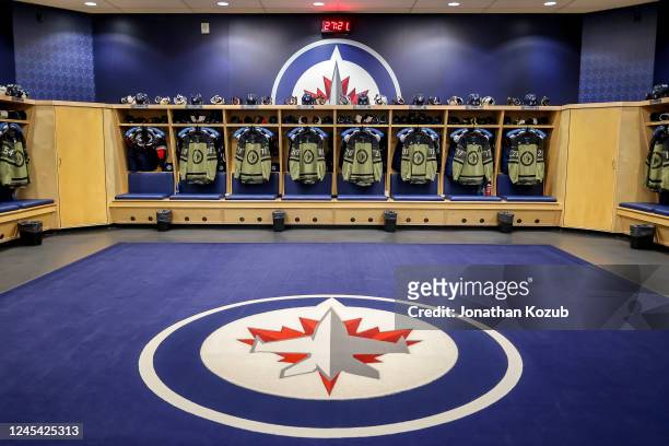 Canadian Armed Forces themed jerseys hang in the locker room prior to NHL action between the Winnipeg Jets and the Florida Panthers on Canadian Armed...