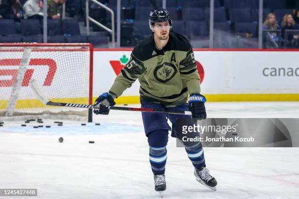 Mark Scheifele of the Winnipeg Jets takes part in the pre-game warm up wearing a special military themed jersey for Canadian Armed Forces...