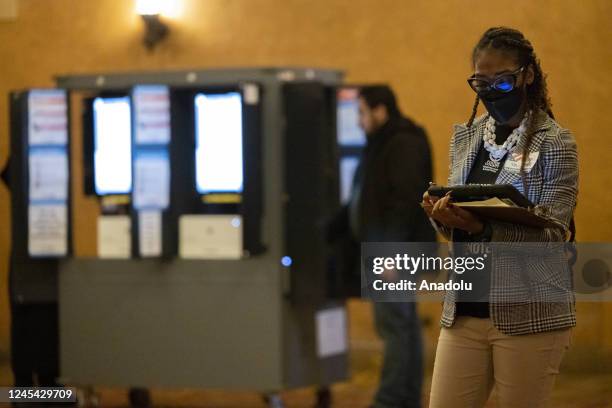 Election workers help voters cast their ballots for the stateâs Senate runoff election on Election Day in Atlanta, Georgia, United States on December...