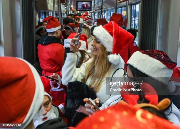 Santas inside a special Santa Tramway. Pupils of the School of Crafts and Entrepreneurship dressed in Santa Claus costumes took part in the...