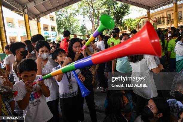 Students attend a campaign for a toxic-free and waste-free Christmas celebration at an elementary school in Quezon City on December 7, 2022.