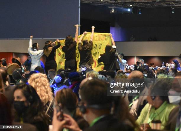 Indigenous people protest as Prime Minister of Canada Justin Trudeau speaks during the opening ceremony of the United Nations Biodiversity Conference...