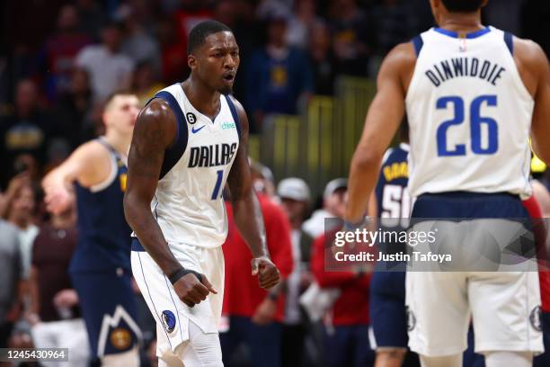 Dorian Finney-Smith of the Dallas Mavericks reacts after a score against the Denver Nuggets in the second half at Ball Arena on December 6, 2022 in...