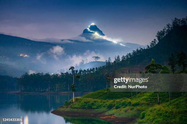 Night view of Sri Pada on January 9 in Maskeliya, Sri Lanka. Adam's Peak, or the Sri Pada, is an important pilgrimage site. Buddhists believe the...