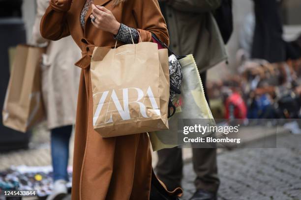 Shopper carries a Zara bag in Lisbon, Portugal, on Tuesday, Dec. 6, 2022. Inflation in the European Union is reaching its peak, according to Economy...