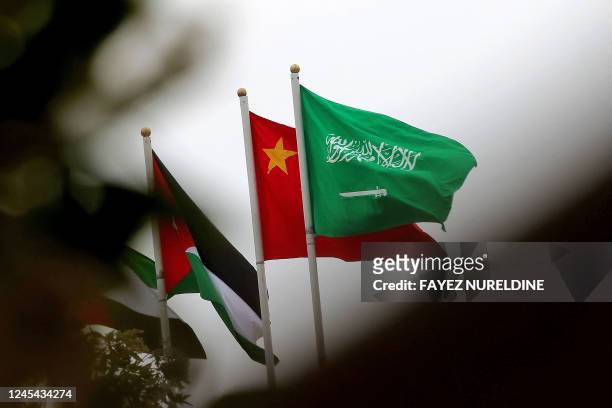 Picture taken on December 7, 2022 in Riyadh, shows the Chinese and the Saudi flags adorning a street ahead of the Chinese president's visit to the...